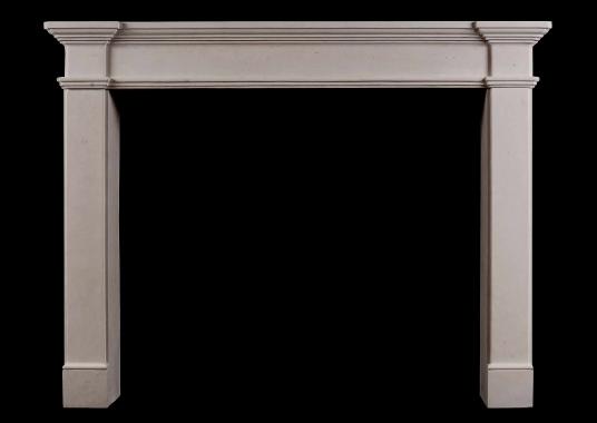 An architectural French limestone fireplace