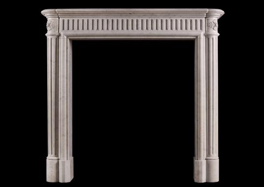 An unusually tall French marble fireplace
