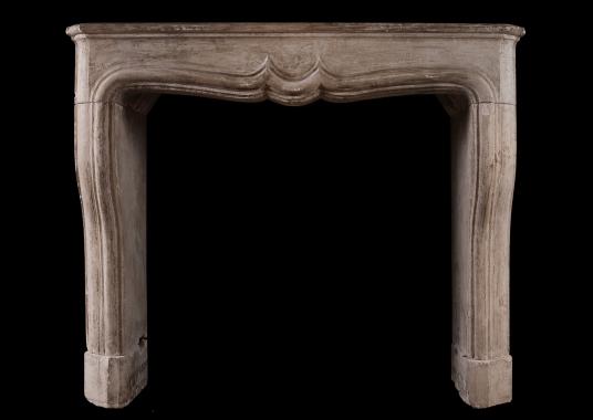 A rustic Louis XIV French fireplace