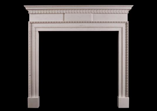 A delicate, late Georgian style white marble fireplace