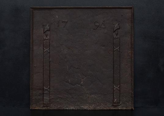 An 18th century cast iron fireback