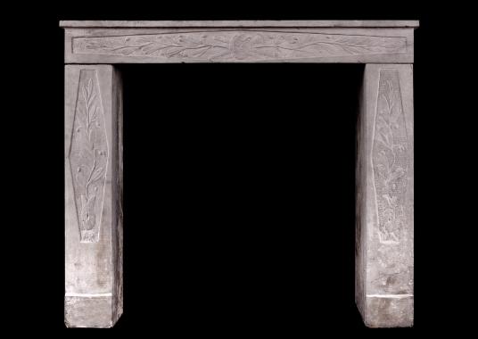 A petite Louis XVI stone fireplace