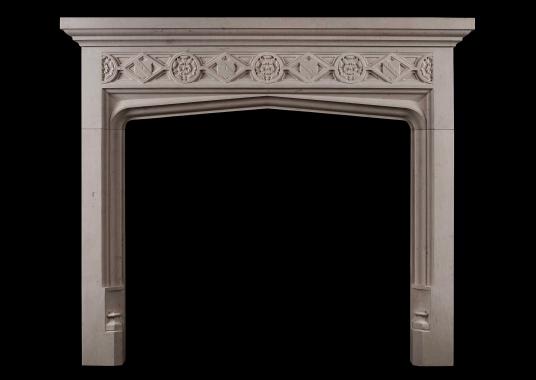 A Gothic style limestone fireplace