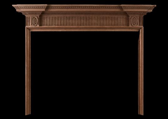 A finely carved English wood fireplace