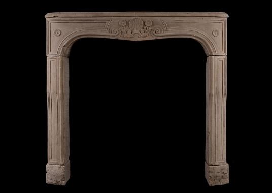 A carved Louis XV limestone fireplace