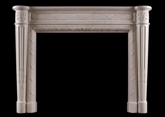 A Louis XVI style marble fireplace with tapering columns