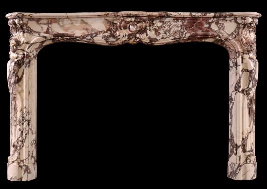 A period Louis XV fireplace in Breche Violette marble