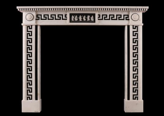 A Regency style white marble fireplace with black inlay