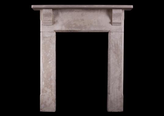 A shabby chic English stone fireplace