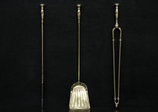 A simple set of brass firetools