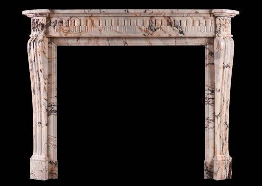 A 19th century French Louis XVI style fireplace in veined marble