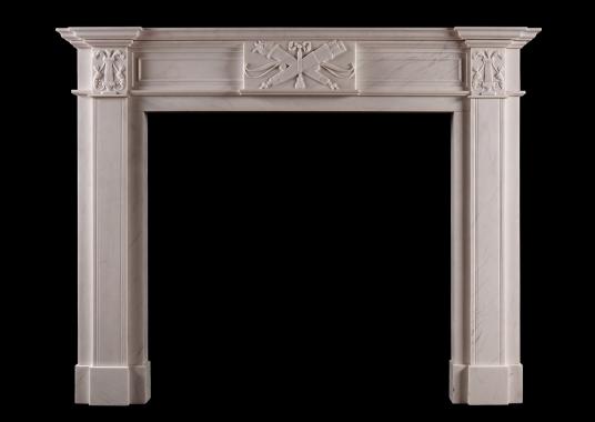 A white marble fireplace in the late Georgian manner