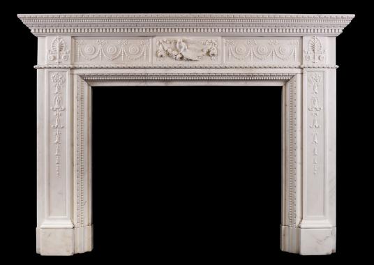 A finely carved Statuary marble fireplace with birds to centre block