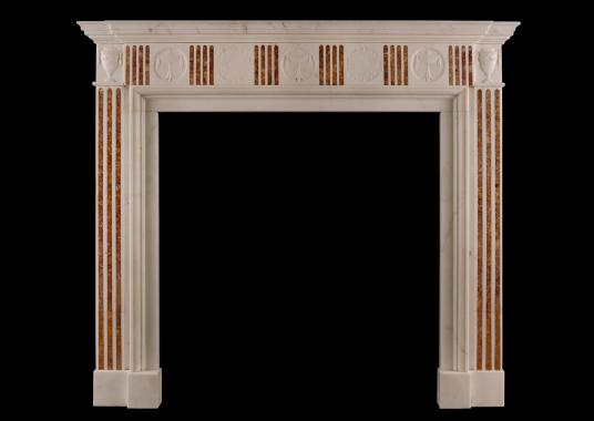 A Regency style marble fireplace with Siena Brocatelle inlay