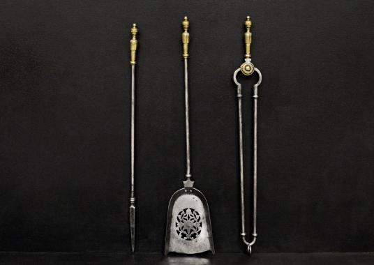 A set of brass and steel antique firetools