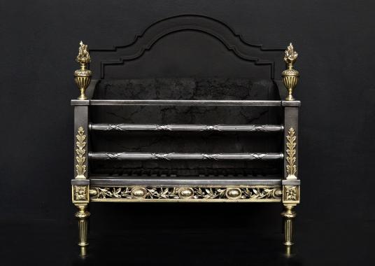 A Regency style brass and steel firegrate