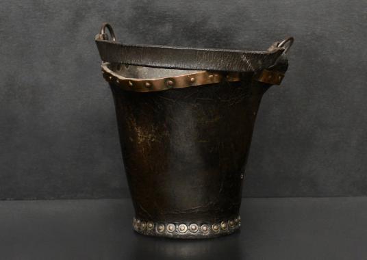 A small leather coal bucket