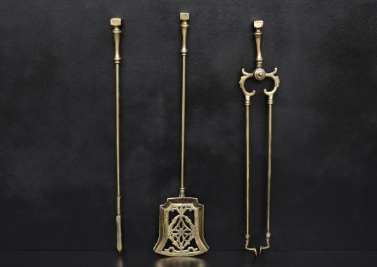 A set of brass Victorian fire tools