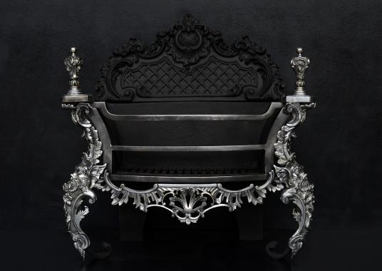 A decorative Rococo firegrate in German silver