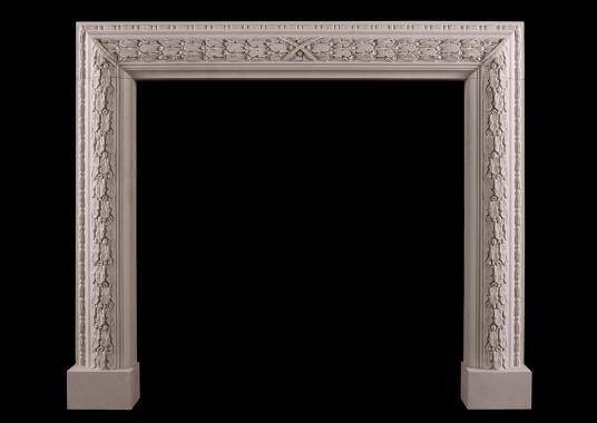 An elegant carved bolection fireplace in limestone