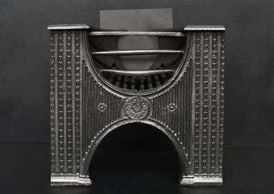 A cast iron hob grate