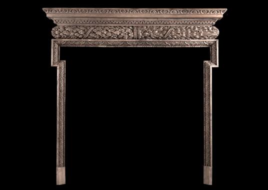 A carved pine fireplace in the Georgian style