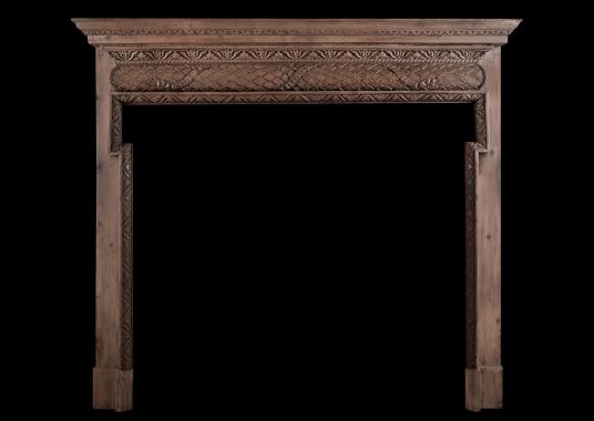 An English carved pine fireplace
