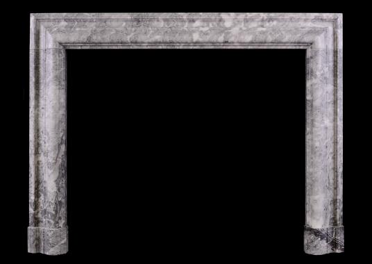 A grey and white marble bolection fireplace