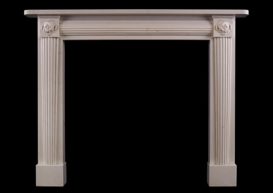 A white marble fireplace in the Regency manner