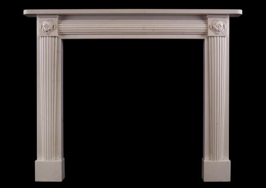 A white marble fireplace in the Regency manner