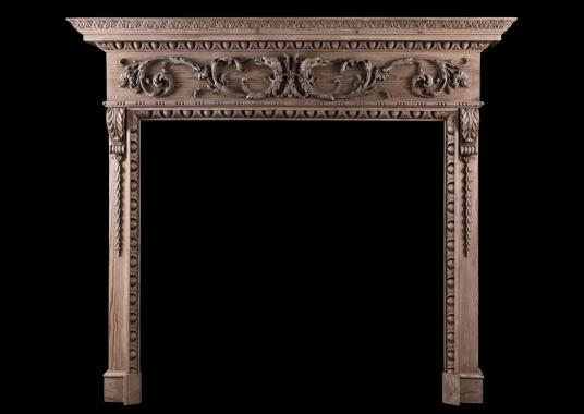 A fine quality carved pine fireplace