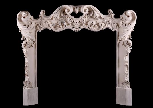 A highly decorative Rococo timber fireplace