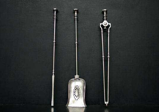 Set of polished steel firetools