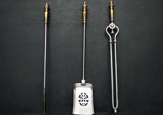 A set of brass and steel firetools