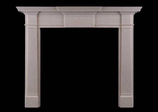 An mid-sized English fireplace in white marble