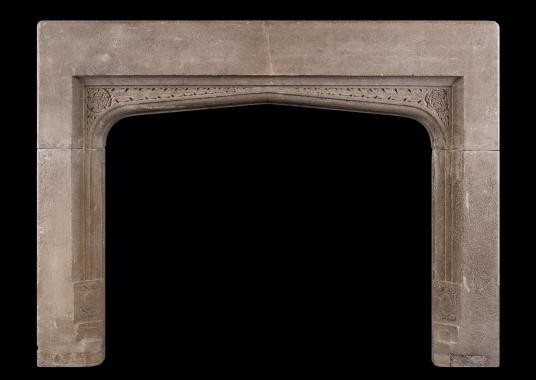 An English stone fireplace in the Gothic manner