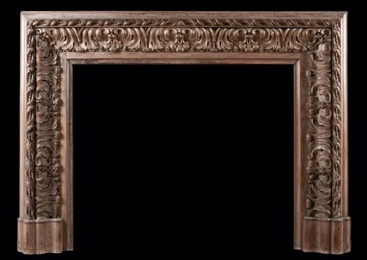 A carved wood bolection fireplace