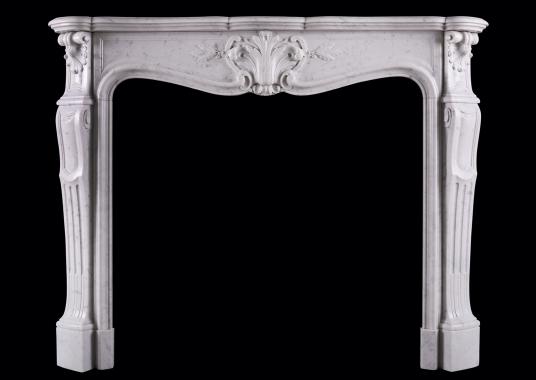A Carrara marble fireplace in the Louis XV manner