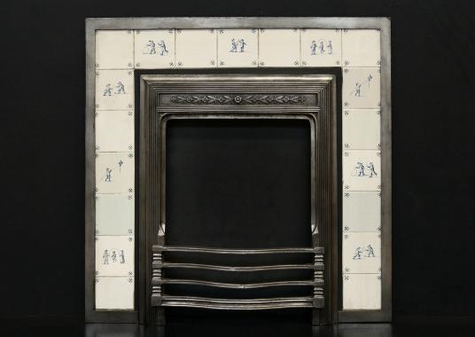 A decorative cast iron fireplace insert with Delft tiles