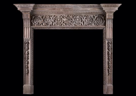 A large and impressive carved wood fireplace