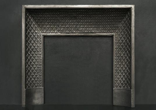 A decorative cast iron contracoeure insert