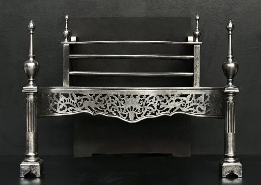 A Georgian style polished steel firegrate