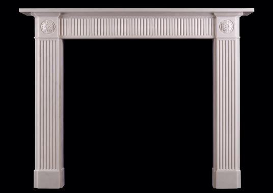 A white marble fireplace in the Regency style