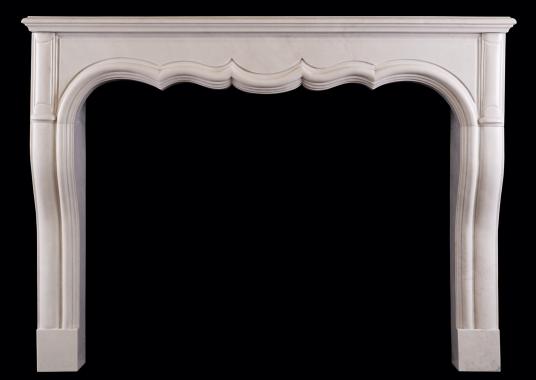 A transitional French LXIV / LXV style fireplace