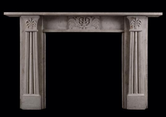 An English stone fireplace in the Regency style