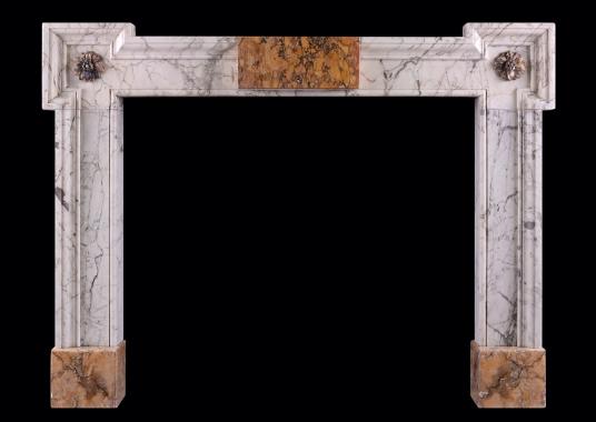 An early Georgian Siena and Statuary marble fireplace