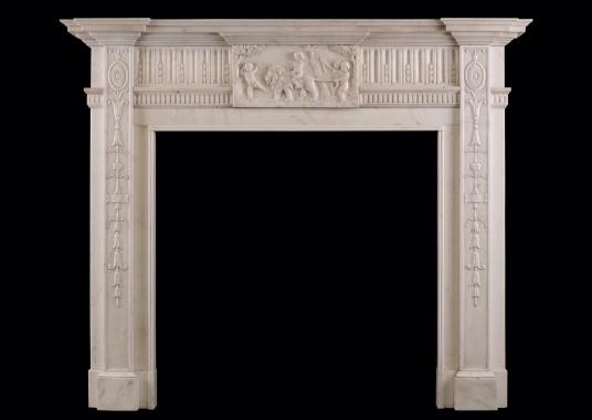 A carved Statuary marble fireplace in the Georgian style