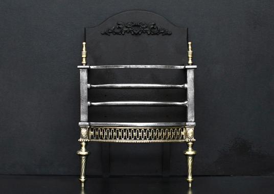 A brass and steel firegrate of small scale