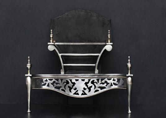 An Adam style polished steel firegrate