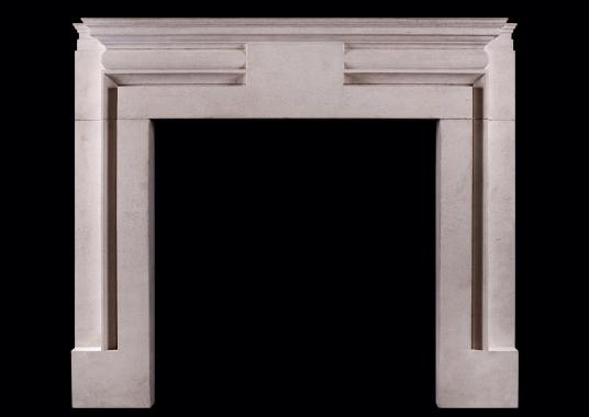 A Portland stone fireplace in the manner of Edwin Lutyens